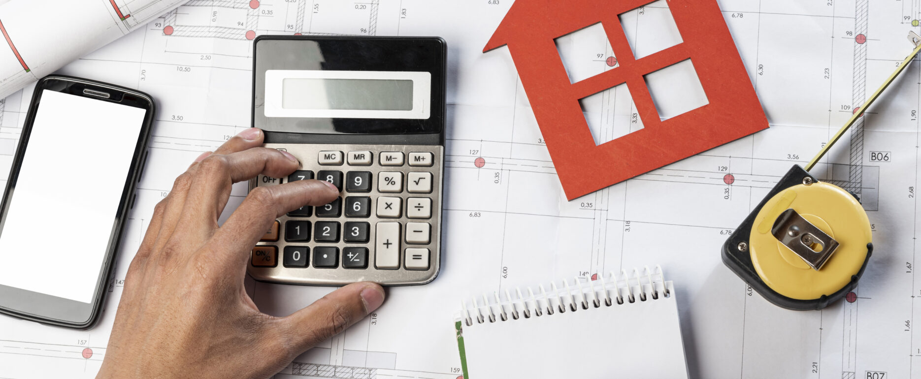 Close-up of mortgage documents and calculator