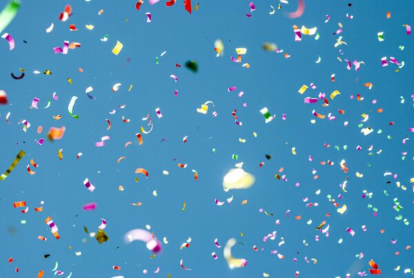 Colourful confetti against a blue sky, celebrating Inverurie being named Scotland's Town of the Year 2026